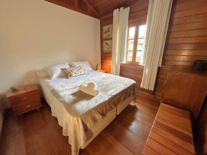 a bedroom with a bed with a tray on it at Refúgio Maravilhoso na barra do Sana | SAAP376 in Sana