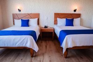 Cama o camas de una habitación en Hotel Del Angel, Apizaco