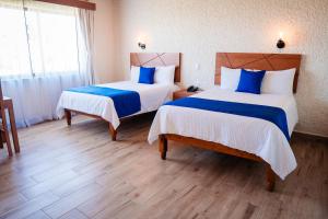 Cama o camas de una habitación en Hotel Del Angel, Apizaco