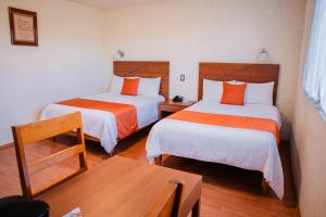 Cama o camas de una habitación en Hotel Del Angel, Apizaco