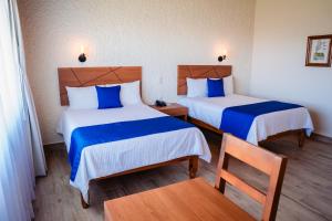 Cama o camas de una habitación en Hotel Del Angel, Apizaco
