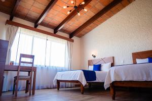 Cama o camas de una habitación en Hotel Del Angel, Apizaco