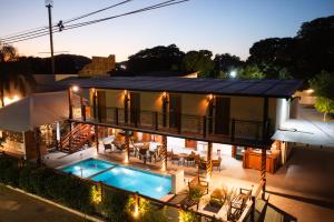 an aerial view of a house with a swimming pool at Pousada Recanto Dourado in Bonito