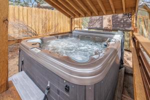 a hot tub in the back of a house at Bear House - EV #3073 in Estes Park