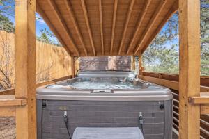 a hot tub in a gazebo with a wooden roof at Bear House - EV #3073 in Estes Park