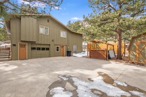 a house with a driveway and a garage at Bear House - EV #3073 in Estes Park