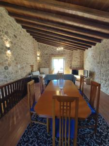 a dining room with a table and chairs at Drymaia Chalet in Amfikleia