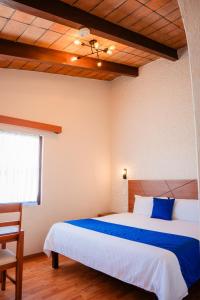 Cama o camas de una habitación en Hotel Del Angel, Apizaco
