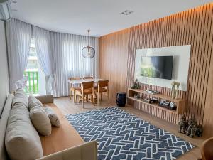 TV a/nebo společenská místnost v ubytování Riviera Sofisticado e Moderno - Enxoval Completo + 37 fotografií