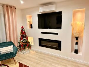 TV a/nebo společenská místnost v ubytování Flori'Home