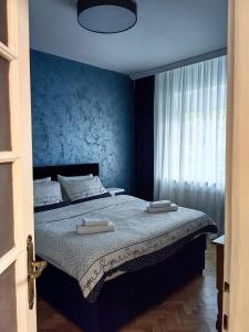 Un pat sau paturi într-o cameră la Apartman Cetkovic +16 fotografii