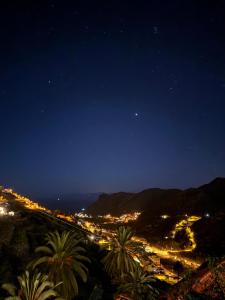 a view of a city at night at Hotel Rural Ibo Alfaro - OFFLINE HOTEL in Hermigua