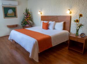 Cama o camas de una habitación en Hotel Del Angel, Apizaco