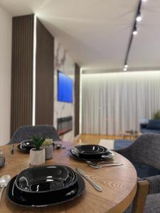 TV a/nebo společenská místnost v ubytování Rest Apartman, Bjelašnica