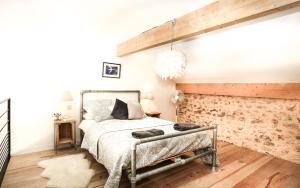 Ένα ή περισσότερα κρεβάτια σε δωμάτιο στο Maison Secrete Apartment 1