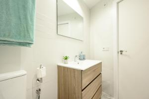 a bathroom with a sink and a mirror at Cautivo 2 in Estepona +17 photos