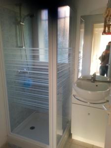 a bathroom with a sink and a shower at bleu marine in Bormes-les-Mimosas