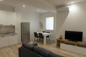 a living room with a couch and a table at Casa Del Portico in Budrio