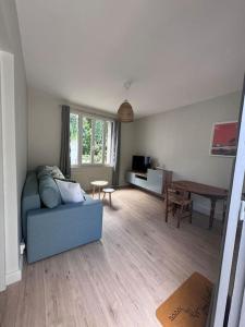 Posezení v ubytování Le Marceau - Maison climatisée avec jardin