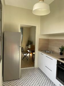Kuchyň nebo kuchyňský kout v ubytování Le Marceau - Maison climatisée avec jardin