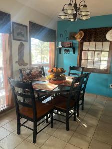 a dining room with a table and chairs at Angel Fire Cabin in Angel Fire