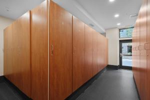 a row of wooden lockers in a locker room at Alpine Luxury Escape At Capitol Peak Lodge in Snowmass Village