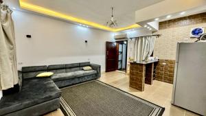 a living room with a couch and a shower at Holidays home in Dahab