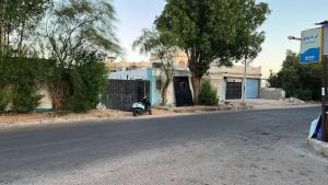 a motorcycle parked on the side of a street at Holidays home in Dahab
