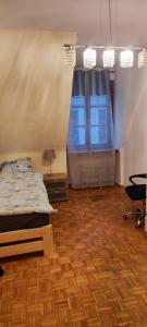 Posteľ alebo postele v izbe v ubytovaní Center Rynek