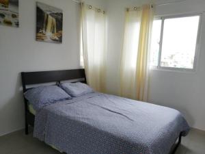 Ένα ή περισσότερα κρεβάτια σε δωμάτιο στο Rincón de Tranquilidad