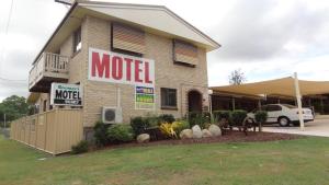 a restaurant with a large sign on the side of the building at Goomeri Motel in Goomeri