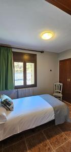 Rúm í herbergi á Apartaments Bonet
