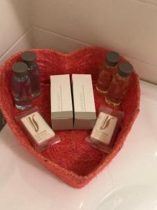 a heart shaped heart with three bottles of honey at Sweet HOME GEMMA in Mestre