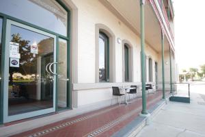 a store front with glass windows on a street at Mitchell River Tavern in Bairnsdale