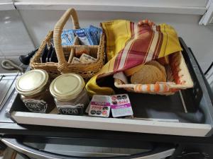 a drawer of a refrigerator filled with food and a basket at Cabañas Ruca Quiyen in General Acha