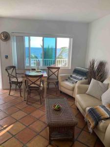 a living room with a couch and a table at Oceanfront Studio in Fort Lauderdale in Pompano Beach