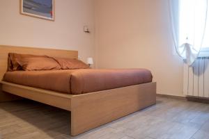 Postel nebo postele na pokoji v ubytování Al numero 6, Trilocale luminoso e accogliente a pochi passi dal mare