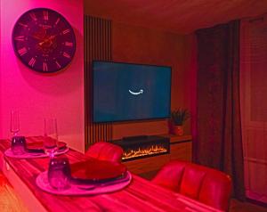 TV a/nebo společenská místnost v ubytování Le boudoir suite&spa