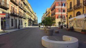 an empty street in a city with buildings at Dimora del Moro in Palermo