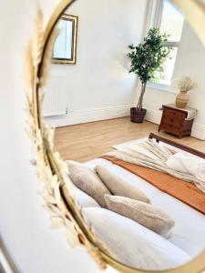 two beds in a room with a mirror at Taswell Road in Portsmouth +48 photos