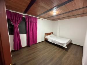 Giường trong phòng chung tại Hospedaje El Peñón