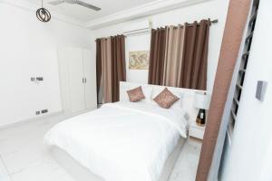 Katil atau katil-katil dalam bilik di Skobs Apartment