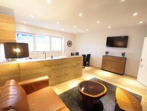 a living room with a couch and a table at Apartmenthaus Bargteheide Apartment 1 in Bargteheide