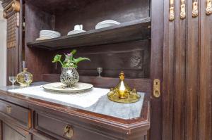 a table with a vase with a plant on it at Apartments Draga in Vrboska +71 photos