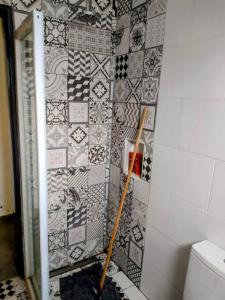 a bathroom being remodeled with a tile wall at La Casita in Embalse