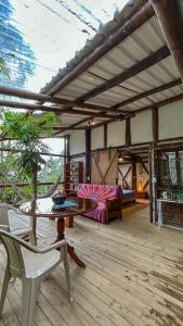 a living room with a table and a couch at Refugio en las Nubes in Santa Elena +95 photos