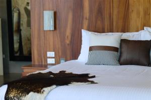 Parra del Valle Hotel Boutique客房内的一张或多张床位