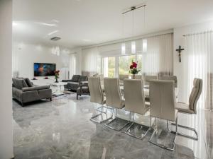 a living room with a dining table and chairs at Villa in Imotski near Blue & Red Lakes in Imotski