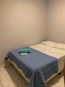 Ένα ή περισσότερα κρεβάτια σε δωμάτιο στο Mini house-Pouso Alto MG