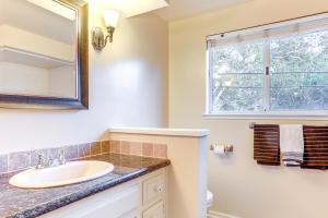 a bathroom with a sink and a mirror at 12 Mi to Folsom Historic District NorCal Getaway in Fair Oaks +27 photos